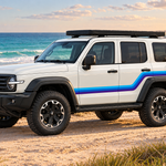 Angled white TANK 300 with blue Alki stripes by an Australian beach