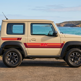 Beige Suzuki Jimny with red stripes in an Australian coastal setting