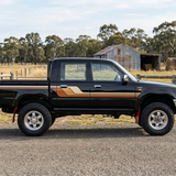 Black Hilux with an Australian farm background