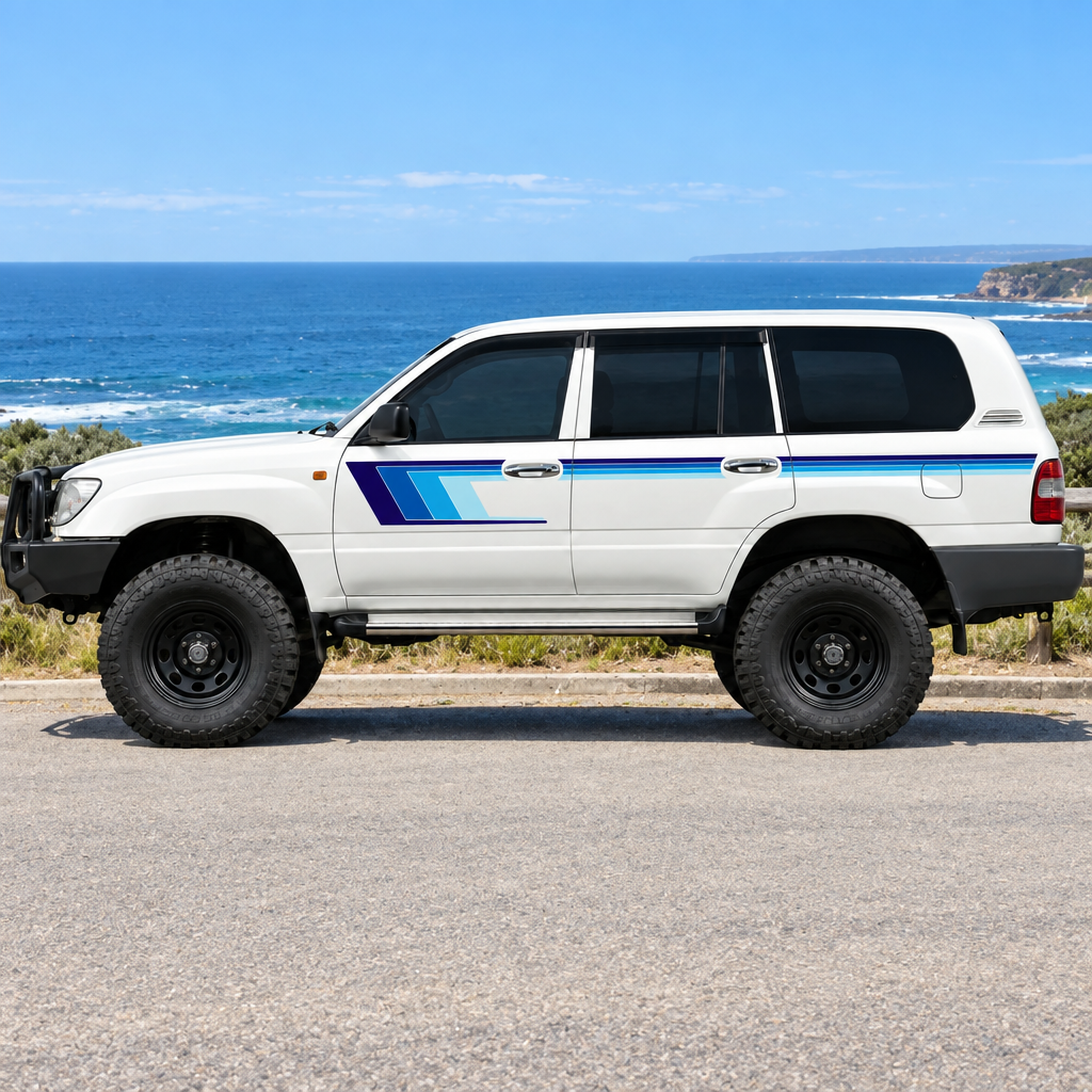 Blue-stripe LandCruiser beside the ocean