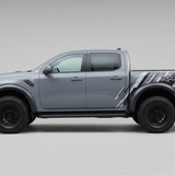 Complete side view of grey Ford Raptor with factory-style stripes
