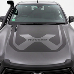 Dark grey Hilux bonnet decal with body-coloured centre X and black RUGGED lettering