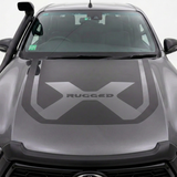 Dark grey Hilux bonnet decal with body-coloured centre X and black RUGGED lettering