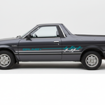 Dark grey Subaru Brumby with teal and white stripes