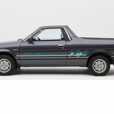 Dark grey Subaru Brumby with teal and white stripes