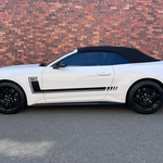 2025 Mustang GT Convertible with precision-cut stripe kit and blurred number plate on a transparent background