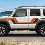 Left-facing Jimny with a coastal background