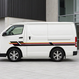 Striped Toyota Hiace in a modern setting with two people in the background