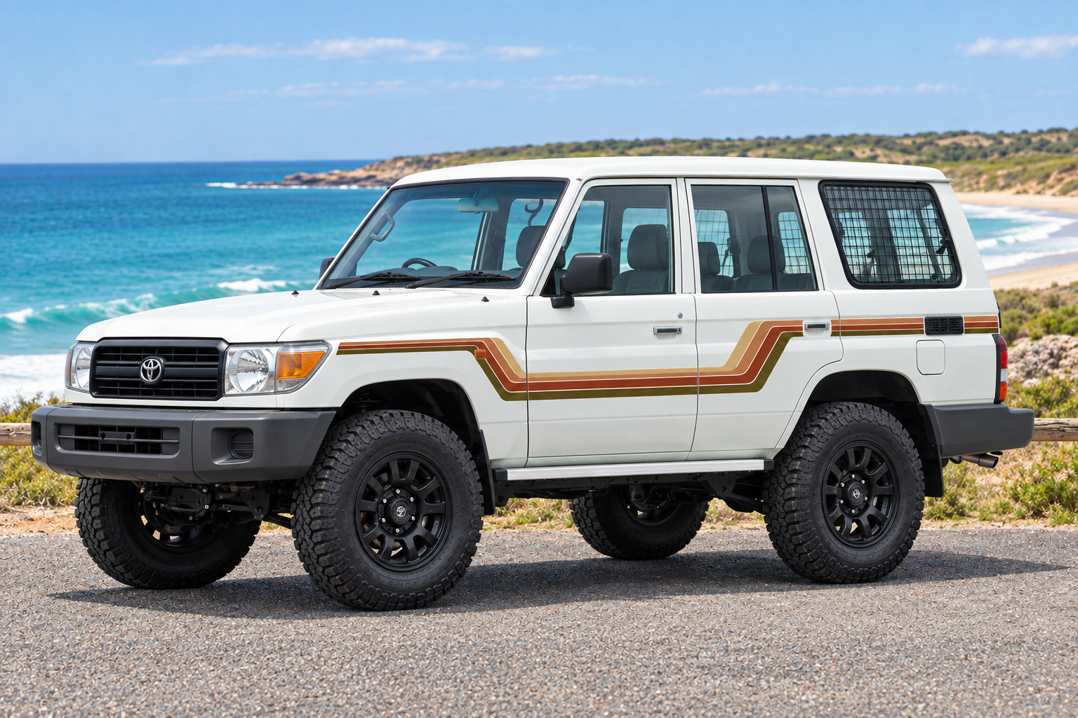White 4WD at a front three-quarter angle beside the coast