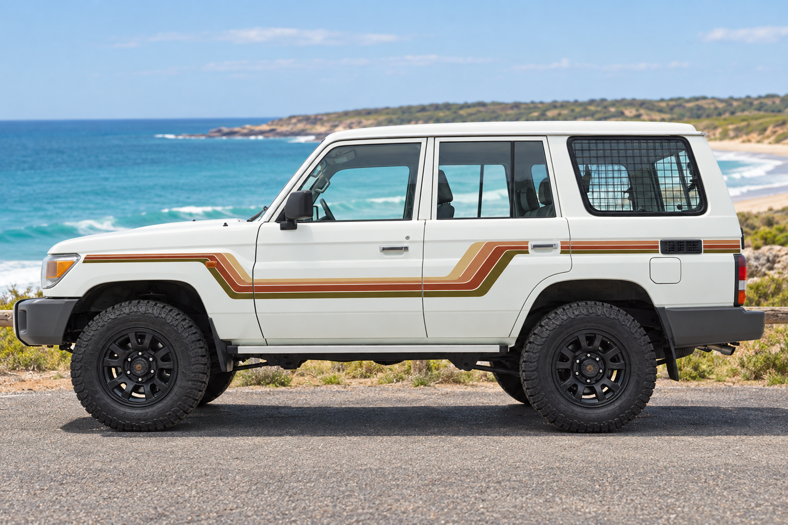 White 4WD with original stripes in an Australian coastal setting