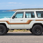 White 4WD with original stripes in an Australian coastal setting