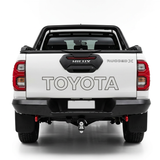 White Toyota Hilux with Toyota and Rugged X tailgate graphics